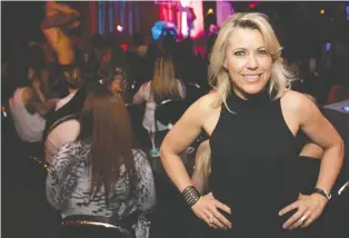  ?? ALLEN MCINNIS FILES ?? Annie Delisle, owner of Le 281, stands in the crowded main room of the famous club that her father founded in 1980. In its heyday, the pioneering male strip club had lineups down the street.