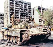  ??  ?? The tragedy of Chechnya: Chechen fighters with a captured Russian tank in Grozny, 1994; Andrei Terentyev, an officer in the Russian combat engineers, right, in 2000; Vladimir Putin with Ramzan Kadyrov in 2004, below