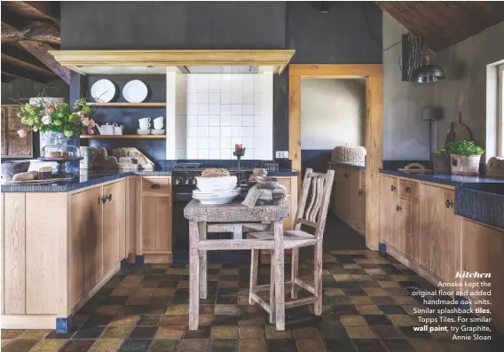  ??  ?? Kitchen Anneke kept the original floor and added handmade oak units. Similar splashback tiles, Topps Tiles. For similar wall paint, try Graphite, Annie Sloan