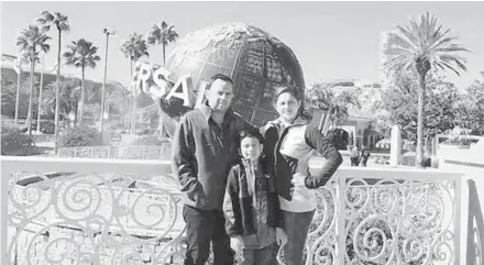  ?? COURTESY ?? Jose Calderón Arana takes a picture with his wife and son in December 2016 at Universal, shortly before he died of a massive heart attack at age 38.