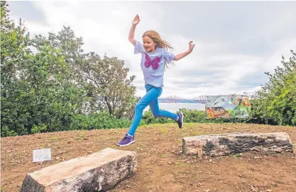  ?? Picture: Steve MacDougall. ?? Fearne Leslie, 7, from Dalgety Bay, has fun at the new viewing area on the coastal path.