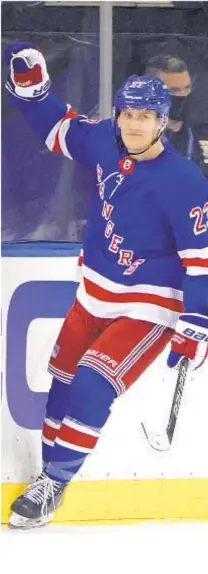  ?? AP ?? Adam Fox celebrates third-period, shorthande­d goal in Rangers’ rout of Penguins Tuesday night at Garden.