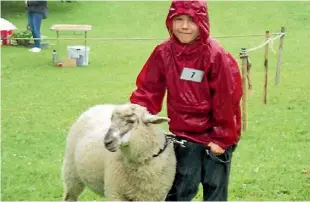  ?? TAUHOA SCHOOL ?? Lucy Innes enjoys last year’s Tauhoa School Calf Club Day.