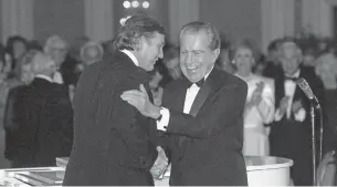  ?? RICHARD NIXON PRESIDENTI­AL LIBRARY & MUSEUM ?? Businessma­n Donald Trump, left, shakes hands with former President Richard Nixon on March 11, 1989, at a tribute gala to Nellie Connally, a former first lady of Texas, in Houston. The letters between Trump and Nixon are on display at the Richard Nixon Presidenti­al Library & Museum.