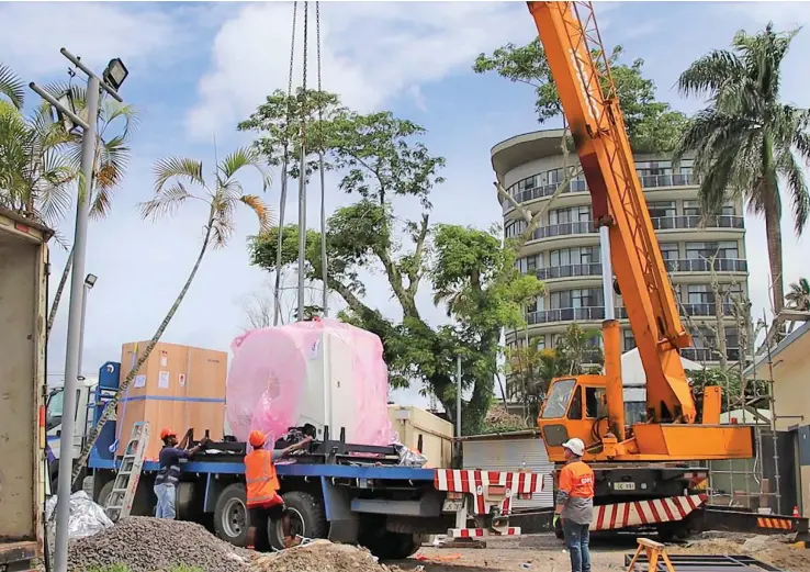  ?? Photo: Oceania Hospital ?? Field workers offload the Magnetic Resonance Imaging (MRI) machine at the new MRI facility at Oceania hospital on November 9, 2022.