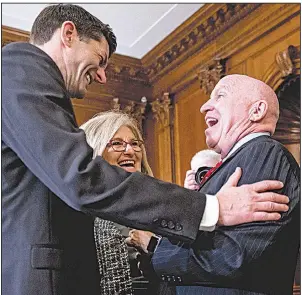  ?? AP/ANDREW HARNIK ?? Speaker of the House Paul Ryan (from left), House Budget Committee Chairman Diane Black, and House Ways and Means Committee Chairman Kevin Brady congratula­te one another Thursday after signing the final version of the GOP tax bill during a ceremony at...