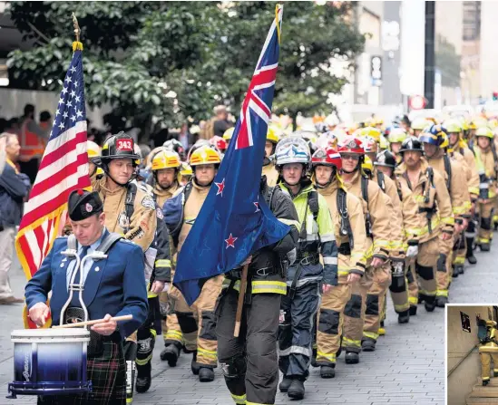  ?? Pictures / Dean Purcell ?? Firefighte­rs from New Zealand and New York honoured fallen comrades with the Sky Tower climb yesterday.