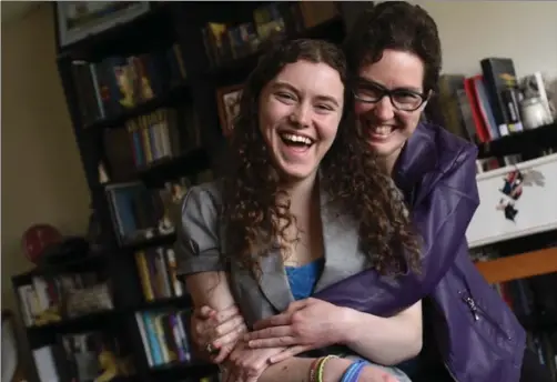  ?? PETER LEE, RECORD STAFF ?? Techiya Loewen hugs her daughter, Rachel, who looked at her mother’s letters as ‘a lifeline’ between Kitchener and the Utah clinic where she received 10 weeks of treatment for an eating disorder two years ago.