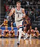  ?? ?? UConn’s Joey Calcaterra reacts after scoring a basket in the first half against Iona during the first round of the NCAA Tournament at MVP Arena on Friday in Albany, N.Y.