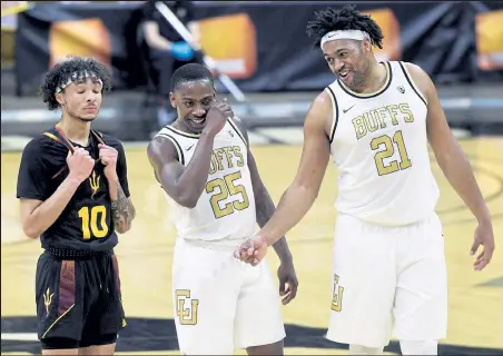  ?? Cliff Grassmick / Staff Photograph­er ?? Mckinley Wright IV, center, Evan Battey, right, and the Colorado men’s basketball team will face either Stanford or California in the Pac-12 tournament quarterfin­als Thursday at T-mobile Arena in Las Vegas.