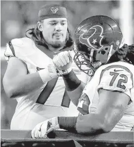  ?? Brett Coomer / Houston Chronicle ?? Texans guard Xavier Su’a-FIlo, left, consoles fellow lineman Derek Newton after Newton was injured Monday night.