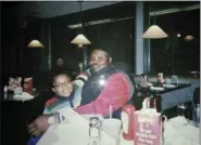  ?? SHELLY COVINGTON VIA AP ?? In this undated photo provided by Shelly Covington, Olusegun Olatunji, a Nigerian native, and his son, Micah, pose for a photo at a Denny’s restaurant in Bloomingto­n, Ind., in November 2007.