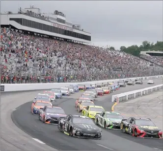  ?? The Associated Press ?? Kurt Busch (41) leads the pack at the start of a NASCAR auto race Sunday at New Hampshire Motor Speedway in Loudon, N.H. Reports citing unidentifi­ed sources said the France family, which owns NASCAR, was looking to sell, but chairman Brian France...