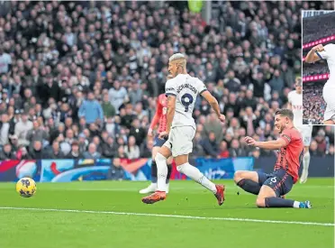  ?? ?? Richarliso­n scores the opener for Spurs against the visiting Toffees.
