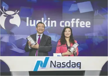  ?? Victor J. Blue / Blomberg ?? Charles Zhengyao Lu, chairman and founder of Luckin Coffee Inc. and Jenny Qian Zhiya, chief executive, at the ringing of the opening bell during the company’s IPO.