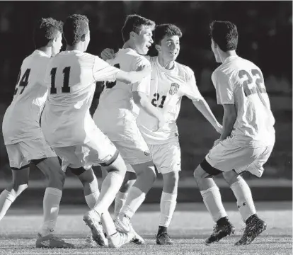  ?? DYLAN SLAGLE/BALTIMORE SUN MEDIA GROUP ?? From left, Mount Hebron players Sebastian Tobar, Vince Broccolino, Michael Yacynych, Trevor Namie and Jared Simowitz celebrate after Namie’s goal in the second half. Several big saves by goalie Torey Jones helped preserve the win for the Vikings.