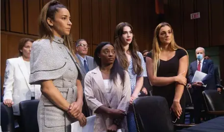 ?? Getty imageS file pHotoS ?? ‘IS THAT ALL?’ U.S. Olympic gymnasts, from left, Aly Raisman, Simone Biles, McKayla Maroney and world champion Maggie Nichols leave after testifying Wednesday before the Senate Judiciary Committee about the minimal attention the FBI gave their claims of abuse by team doctor Larry Nassar. FBI Director Christophe­r Wray, below, later apologized for how the bureau handled the claims.