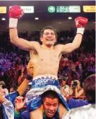  ?? ASSOCIATED PRESS FILE ?? Marco Antonio Barrera raises his arms in victory as he parades around the ring after his victory over Prince Naseem Hamed for the IBO featherwei­ght title in 2001.