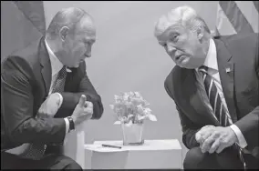  ?? AP PHOTO ?? U.S. President Donald Trump meets with Russian President Vladimir Putin at the G-20 Summit in Hamburg last year. The Kremlin and the White House announced Thursday that a summit between Putin and Donald Trump will take place in Helsinki on July 16.