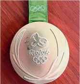  ??  ?? Damaged goods: Kyle Snyder’s damaged gold metal from the 2016 Rio Olympics. — AP