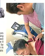  ??  ?? One of the visi tors during the launching of Piezo Shock wave treatment tries how it feels to be treated by this breakthrou­gh in physical therapy.