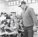  ?? STEVE RUARK/BALTIMORE SUN MEDIA GROUP ?? Orioles manager Brandon Hyde greets students during an Orioles rally at Timonium Elementary School on Friday.