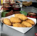  ?? RICKY WILSON/STUFF ?? Lunar New Year is a busy time for Shelley Loh, pictured below with her mum Joanne Lee, with great demand for her nian gao (Chinese New Year cake), below, and the everpopula­r curry puffs, left.