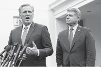  ?? Alex Wong / Getty Images ?? Reps. Kevin McCarthy of California and Michael McCaul of Austin talk to reporters after meeting with the president.