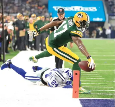  ?? | GETTY IMAGES ?? Packers receiver Davante Adams caught five passes for 76 yards Sunday against the Cowboys before getting hurt.