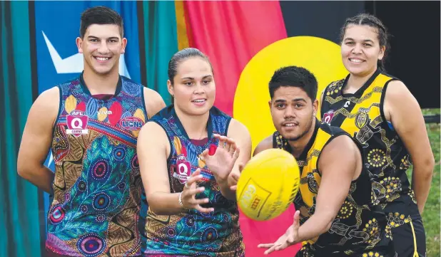  ?? Picture: ANNA ROGERS ?? DISPLAY OF PRIDE: Lions players Brodie Deverell and Luana Healey with Tigers players Noona Morgan and Leashay Warburton-Richards who are playing in the AFL Cairns's Indigenous Round, Dream Time by the Sea.