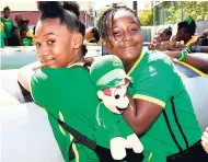  ?? GRINDLEY/CHIEF PHOTO EDITOR NORMAN ?? Kara-Ann Sooka (left) and Ayanna Powell, students at the St George’s Primary and Infant School, enjoying the Jamaica Day activities.