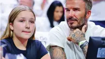  ?? ?? Frightened: Beckham, with daughter Harper