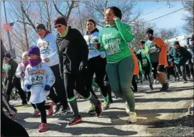  ?? TANIA BARRICKLO — DAILY FREEMAN FILE ?? Runners take off from start at last Sunday’s annual Shamrock Run in Kingston, N.Y.