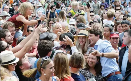  ?? DAVID CROMPTON/Penticton Herald ?? Prime Minister Justin Trudeau poses for selfies with the crowd at a BC Family Day event in Penticton, Monday.