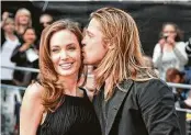  ?? Dominic Lipinski / Tribune News Service ?? Brad Pitt and Angelina Jolie split after 12 years.