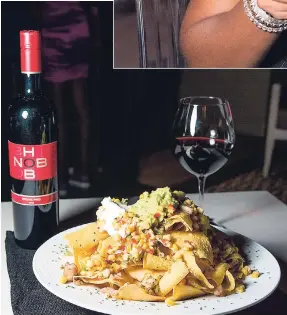 ??  ?? CRU caters to all your needs. Your taste buds will leave happy with this scrumptiou­s nachos with the lovely taste of Hob Nob Cellars Wicked Red.