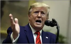  ?? EVAN VUCCI — THE ASSOCIATED PRESS ?? President Donald Trump answers questions from reporters during an event on “transparen­cy in Federal guidance and enforcemen­t” in the Roosevelt Room of the White House on Wednesday in Washington.