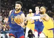  ?? Wally Skalij Los Angeles Times ?? NUGGETS guard Jamal Murray drives past the Lakers’ D’Angelo Russell in last year’s conference finals.