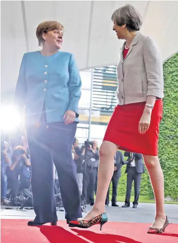  ??  ?? German chancellor Angela Merkel welcomes Theresa May to a meeting of European leaders in Berlin before next week’s G20 summit