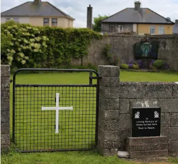  ??  ?? SO MUCH PAIN: A memorial at the area where many infants’ bodies were buried in Tuam