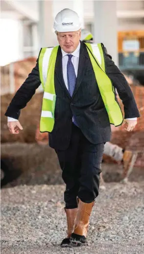  ??  ?? Prime Minister Boris Johnson visits the constructi­on site of the new dedicated Vaccines Manufactur­ing Innovation Centre (VMIC) currently under constructi­on on the Harwell science and innovation­s campus near Didcot in central England. The building is being constructe­d to manufactur­e vaccines for Covid-19 and is set to open next summer.