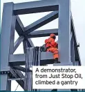  ?? ?? A demonstrat­or, from Just Stop Oil, climbed a gantry