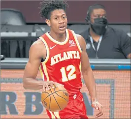  ?? SARAH STIER — GETTY IMAGES ?? De’Andre Hunter, the Hawks’ best perimeter defender, is undergoing knee surgery and will miss the rest of Atlanta’s series against the 76ers, which is tied 1-1.