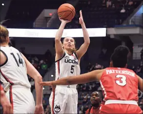  ?? Jessica Hill / Associated Press ?? UConn’s Paige Bueckers shoots her first basket against St. John’s in her return from injury on Friday night at the XL Center in Hartford.