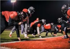  ?? NATE HECKENBERG­ER — FOR DIGITAL FIRST MEDIA ?? Coatesvill­e’s Jimmy Limper lines up in a drill, Thursday night. Limper has started three seasons at defensive end and the front four is a veteran force for the Red Raiders.