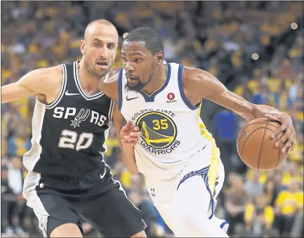  ?? NHAT V. MEYER — STAFF PHOTOGRAPH­ER ?? Kevin Durant, who had 24points, seven assists and eight rebounds, dribbles against the Spurs’ Manu Ginobili in Saturday’s win.