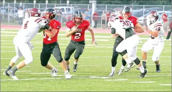  ?? Photograph submitted ?? Blackhawk junior Wyatt Weber (No. 37) blocked as Blackhawk junior Zaine Holley (No. 2) carried the ball downfield Friday night. Holley made seven touchdowns for the ’Hawks Friday.