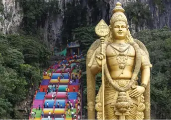  ?? — Malay Mail photo ?? Devotees and visitors are pictured climbing the steps to Batu Caves in Kuala Lumpur.