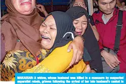  ?? —AFP ?? MAKASSAR: A widow, whose husband was killed in a massacre by suspected separatist rebels, grieves following the arrival of her late husband’s casket in Makassar, South Sulawesi, on Friday.