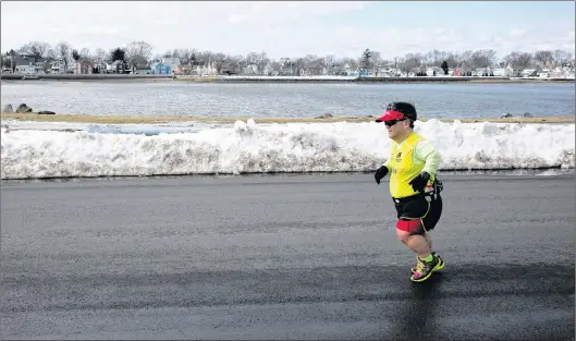  ?? AP PHOTO ?? Marathon runner John Young, of Salem, Mass., trains in Salem in mid March.